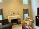 Bright living room with fireplace, high ceilings, and large windows at 3233 Rockmill Dr, Ellenwood, GA 30294
