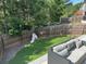 Backyard featuring a small slide, a grassy area, and an outdoor sectional seating area at 370 Winston Cir, Canton, GA 30114