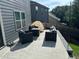 Backyard patio with stamped concrete, outdoor furniture and a small white and yellow tent at 370 Winston Cir, Canton, GA 30114
