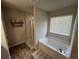 Elegant bathroom featuring a soaking tub and a separate shower with neutral colors at 370 Winston Cir, Canton, GA 30114