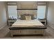 Bedroom with a large bed, side tables, and decorative lighting with neutral decor at 370 Winston Cir, Canton, GA 30114