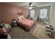 Bright bedroom with pink accent wall, a large window and ample natural light at 370 Winston Cir, Canton, GA 30114