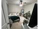 Neutral bedroom featuring a ceiling fan and a decorative floor mirror and indoor plant at 370 Winston Cir, Canton, GA 30114