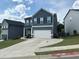 Charming two-story home featuring a two-car garage and a well-maintained front yard at 370 Winston Cir, Canton, GA 30114