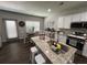 Kitchen with granite countertops, stainless steel appliances and an island with bar stool seating at 370 Winston Cir, Canton, GA 30114