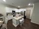 Kitchen with granite countertops, stainless steel appliances and an island with bar stool seating at 370 Winston Cir, Canton, GA 30114