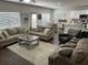 Open-concept living area with multiple windows for natural light and dark hard wood floors at 370 Winston Cir, Canton, GA 30114
