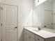 Bathroom featuring a white vanity with modern fixtures and a large mirror at 3865 Shelleydale Dr # 82, Powder Springs, GA 30127