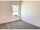 Cozy bedroom featuring neutral carpet and a window for natural light at 3865 Shelleydale Dr # 82, Powder Springs, GA 30127