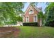 Beautiful brick home with manicured lawn, surrounded by mature trees, offering privacy and curb appeal at 5435 Chelsen Wood Dr, Duluth, GA 30097