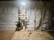 Unfinished basement utility area with concrete floors and visible piping system at 1413 David Cir, Decatur, GA 30032