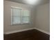 A well-lit bedroom with a large window and neutral walls at 1413 David Cir, Decatur, GA 30032