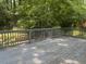 Spacious wooden deck with railing, ideal for outdoor entertaining in a private backyard setting at 1413 David Cir, Decatur, GA 30032