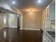 Open dining room area with modern chandelier and view into the kitchen at 1413 David Cir, Decatur, GA 30032