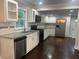 Modern kitchen with granite countertops, stainless steel appliances, and ample cabinet space at 1413 David Cir, Decatur, GA 30032