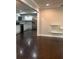 Bright living room with hardwood floors and a view into the kitchen at 1413 David Cir, Decatur, GA 30032