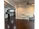 Open-concept living room and kitchen area with hardwood floors and plenty of light at 1413 David Cir, Decatur, GA 30032