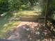 Outdoor patio surrounded by nature in a private backyard setting at 1413 David Cir, Decatur, GA 30032