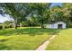 Spacious green backyard with an outbuilding, perfect for storage or as a workshop at 3561 Clay Rd, Austell, GA 30106