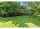 Lush backyard provides a serene atmosphere with mature trees, perfect for relaxation or entertainment at 3561 Clay Rd, Austell, GA 30106