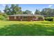 Brick home featuring a spacious backyard and porch, perfect for outdoor living at 3561 Clay Rd, Austell, GA 30106