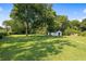Large, green backyard featuring a versatile outbuilding, ideal for hobbies or storage at 3561 Clay Rd, Austell, GA 30106