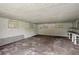 Unfinished basement featuring concrete flooring, windows, and white painted walls at 3561 Clay Rd, Austell, GA 30106