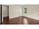 Cozy bedroom featuring hardwood floors, a window, and a closet, perfect for comfortable living at 3561 Clay Rd, Austell, GA 30106