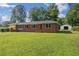 Charming single story home with lush front yard, brick facade, and a storage shed at 3561 Clay Rd, Austell, GA 30106