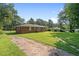 Brick home featuring a spacious backyard and driveway offering ample parking at 3561 Clay Rd, Austell, GA 30106