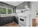 Spacious kitchen featuring ample counter space, a stove, and natural light streaming through the window at 3561 Clay Rd, Austell, GA 30106