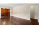 Open-concept living room with hardwood floors, offering a seamless flow into adjoining spaces at 3561 Clay Rd, Austell, GA 30106