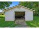 Outbuilding with double doors offering ample storage space, potential workshop or studio at 3561 Clay Rd, Austell, GA 30106