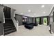Basement with dark accent walls, carpeted stairs, recreational area and a serving bar at 4130 Millbrook Ct, Suwanee, GA 30024