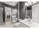 Unique bathroom design featuring modern fixtures, mirrored wall, decorative lighting, and a sleek, clean aesthetic at 4130 Millbrook Ct, Suwanee, GA 30024