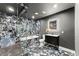 Stunning bathroom featuring black marble walls, glass shower and modern vanity at 4130 Millbrook Ct, Suwanee, GA 30024