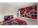 Bedroom features a wall decorated with red, black, and gray triangles at 4130 Millbrook Ct, Suwanee, GA 30024