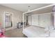 bedroom with purple accent walls, featuring carpet flooring, ample closet space, and en-suite bathroom access at 4130 Millbrook Ct, Suwanee, GA 30024