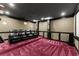 Spacious home theater with plush seating, carpet and dark trim at 4130 Millbrook Ct, Suwanee, GA 30024