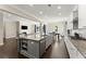 Open kitchen and dining area flow seamlessly into the living room, creating an inviting and connected living space at 4130 Millbrook Ct, Suwanee, GA 30024