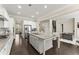 Open-concept kitchen featuring a large island, stainless steel appliances, and seamless flow to the living area at 4130 Millbrook Ct, Suwanee, GA 30024