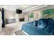 The main bedroom offers a tray ceiling, television, and an adjoining door to the main bathroom at 4130 Millbrook Ct, Suwanee, GA 30024