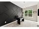 Modern office space with dark accent wall, stylish lighting, a spacious window view, and contemporary desk setup at 4130 Millbrook Ct, Suwanee, GA 30024