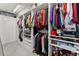 Walk-in closet showcasing custom shelving, ample storage space, and organization systems at 4130 Millbrook Ct, Suwanee, GA 30024