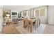 Open-concept dining room and living room featuring modern decor and ample natural light at 8505 Poston Place Lot 141, Douglasville, GA 30134