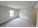 Bright carpeted bedroom with natural light from a window and a neutral color palette at 2674 Mourning Dove Drive (Lot 37), Grayson, GA 30017