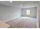 Large bonus room with plush carpet, recessed lighting and a bright window overlooking the property at 2674 Mourning Dove Drive (Lot 37), Grayson, GA 30017