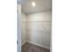 A walk in closet with a carpeted floor and single shelf for optimal organization at 2674 Mourning Dove Drive (Lot 37), Grayson, GA 30017