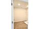 Walk in closet with wood look flooring, a light and a single shelf for optimal organization at 2674 Mourning Dove Drive (Lot 37), Grayson, GA 30017
