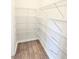 Walk-in pantry featuring wood-look flooring and wire shelving for ample storage at 2674 Mourning Dove Drive (Lot 37), Grayson, GA 30017